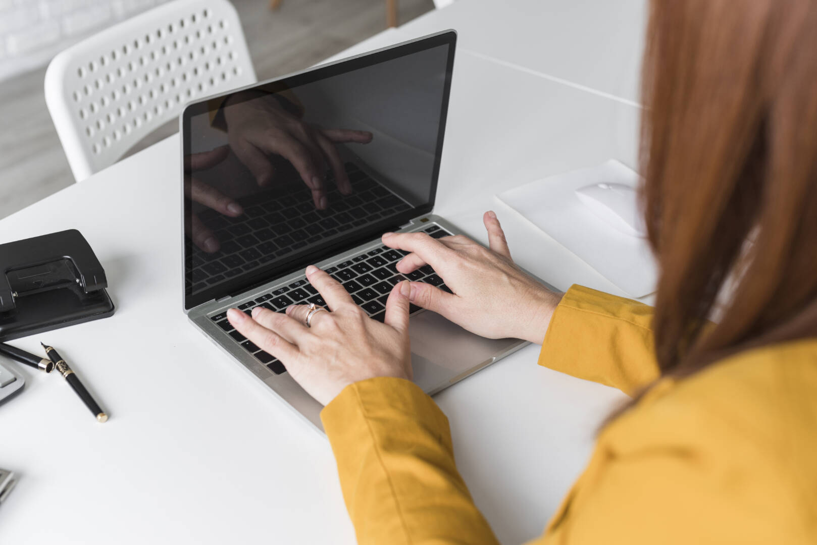 high-angle-female-working-laptop